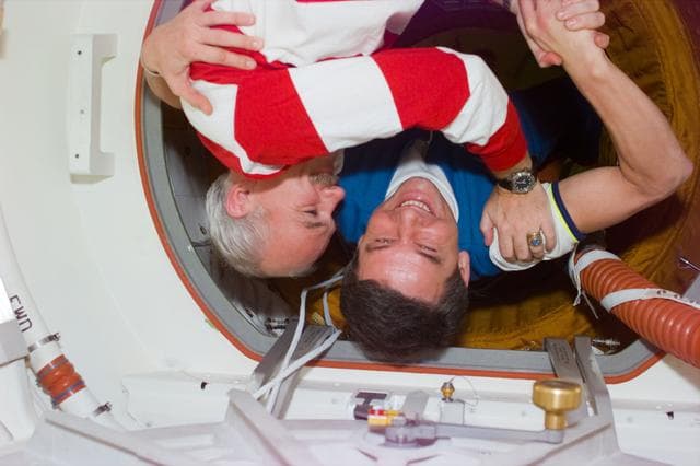 NASA image: Greeting between STS-79 commander and Mir 22 commander after docking