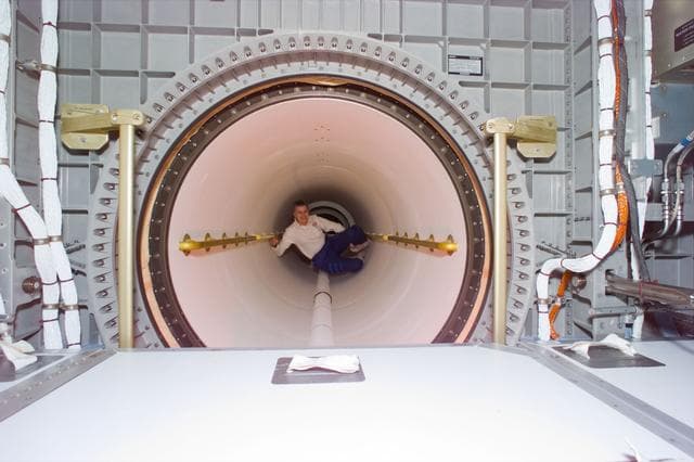 NASA image: Astronaut Lucid in transfer tunnel