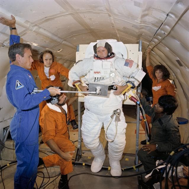 NASA image: Astronaut C. Gordon Fullerton in suit donning/doffing exercise