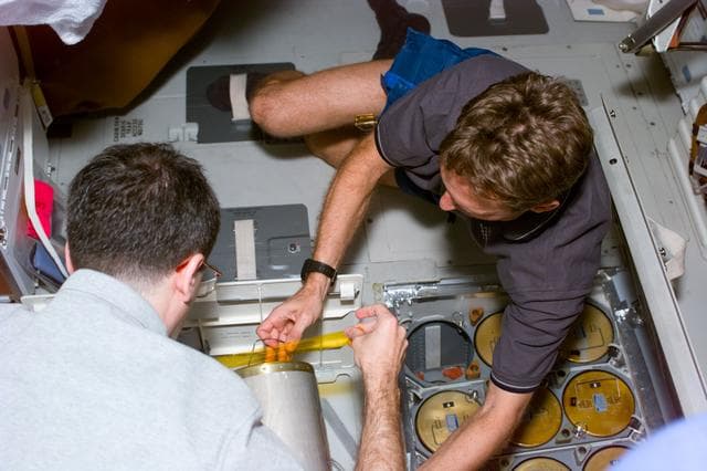 NASA image: MS Wisoff and Linenger perform Lioh changeout