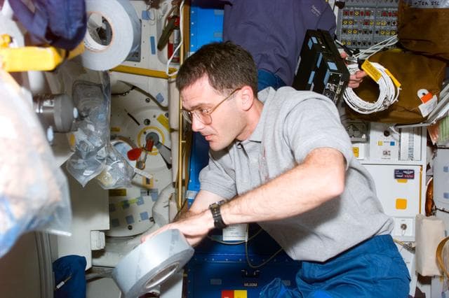 NASA image: MS Wisoff with duct tape on the middeck