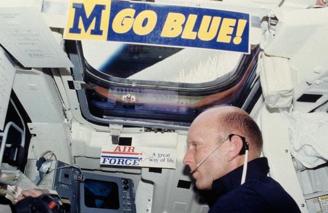Pilot Fullerton reviews checklist on Aft Flight Deck Onorbit Station