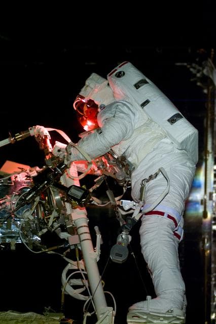EVA 4 activity on Flight Day 7 to service the Hubble Space Telescope
