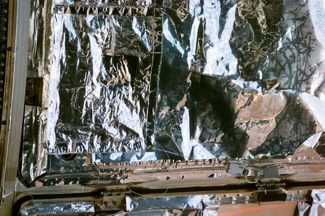 NASA image: HST,survey of the MLI patches installation