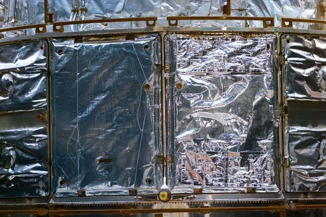 NASA image: HST,survey of solar arrays and telescope surface