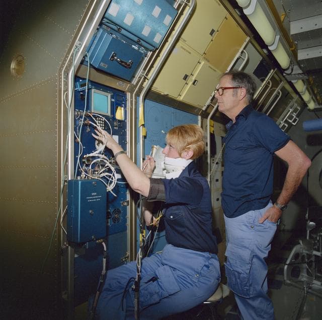 NASA image: SLS-1 crewmembers in high fidelity mockup of the Spacelab