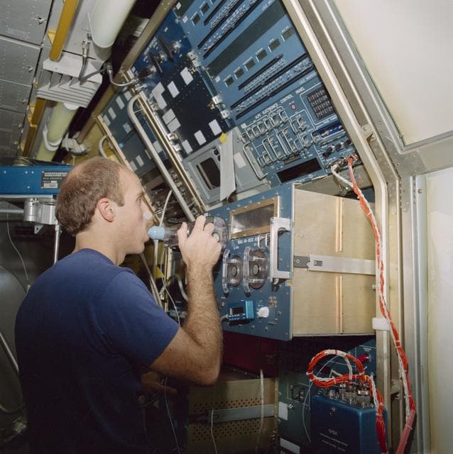 NASA image: SLS-1 crewmembers in high fidelity mockup of the Spacelab