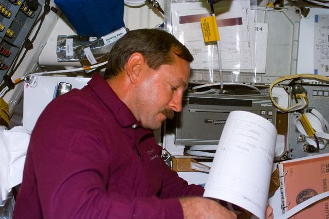 NASA image: Candid views of STS-85 crewmembers in the middeck