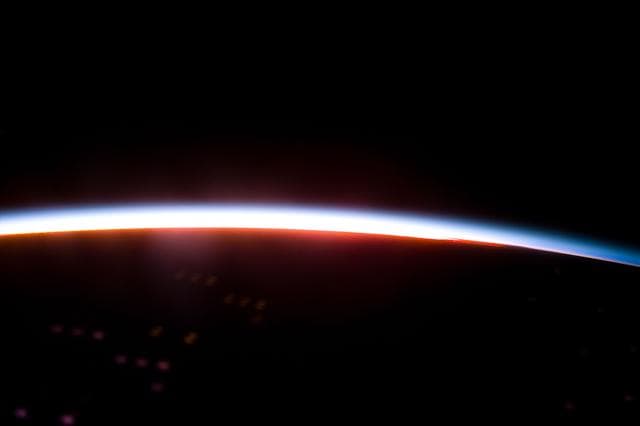 NASA image: The Earth limb glows shortly after an orbital sunrise