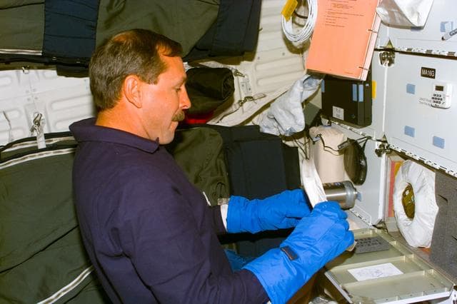 NASA image: BRIC - Brown works with middeck experiment