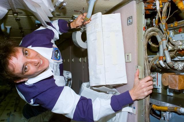 NASA image: Currie in FGB during repair of battery recharger