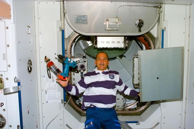 NASA image: Sturckow in Node 1/Unity module with power tool