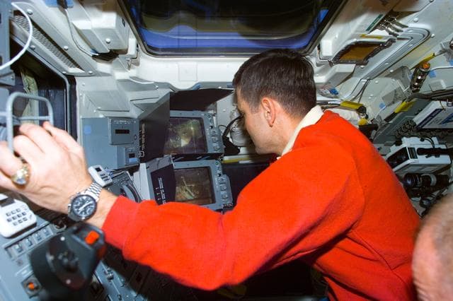 NASA image: Cabana at RMS controls on the aft flight deck during EVA