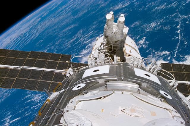 NASA image: Newman during EVA 3 working on cables