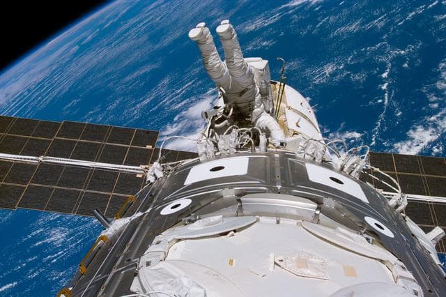 NASA image: Newman during EVA 3 working on cables