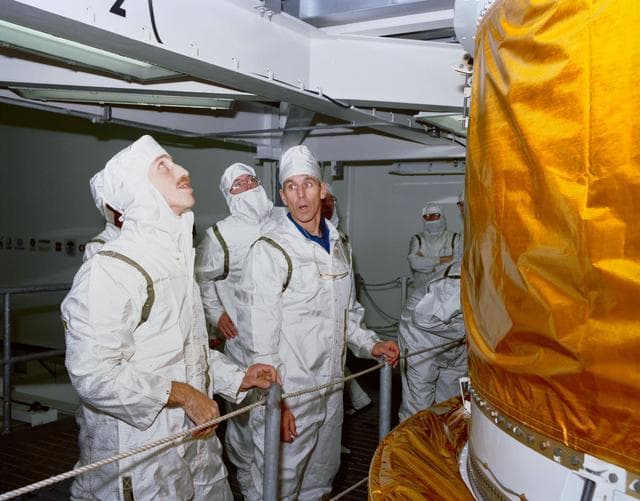 NASA image: STS-29 crewmembers inspect TDRS-D inertial upper stage (IUS) at KSC VPF