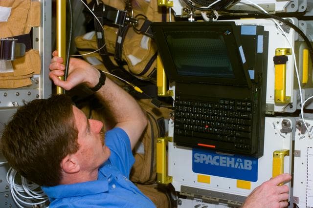 NASA image: STS-89 crewmembers perform various tasks onboard Endeavour