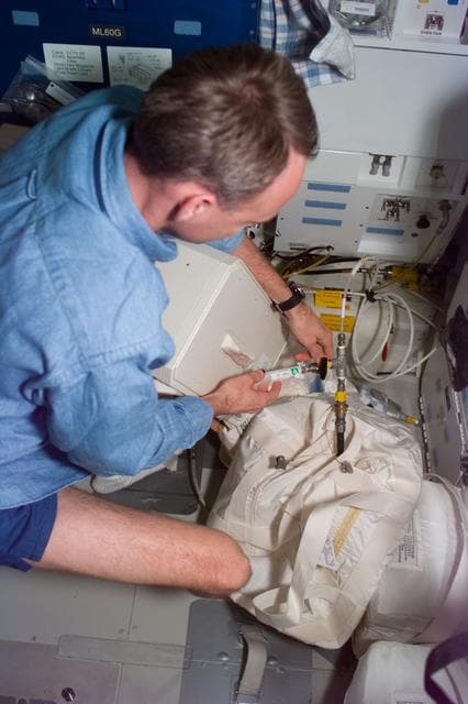 NASA image: RME 1331 - Pilot Edwards with SCCI equipment