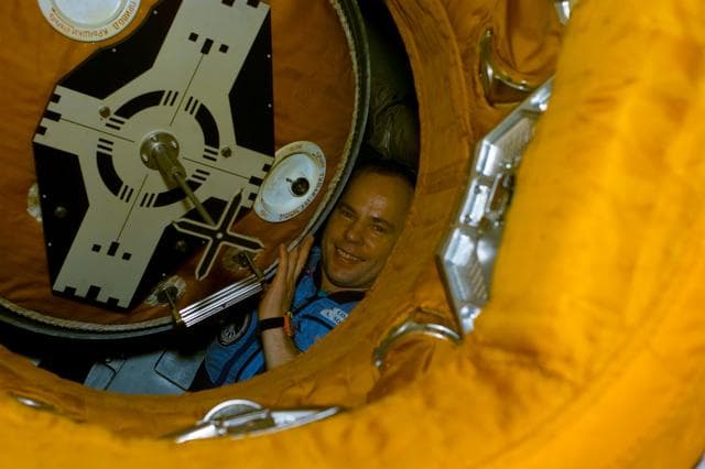NASA image: STS-89 and Mir 24 crews at the hatch opening