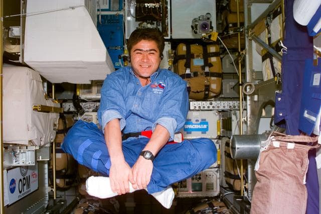 NASA image: MS Sharipov floats, cross-legged, onboard Spacehab