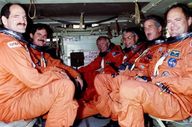 NASA image: STS-35 crewmembers in M113 tracked vehicle during TCDT at KSC