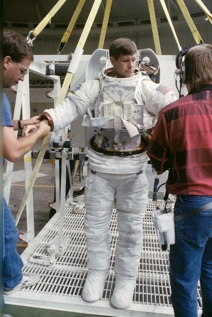 NASA image: STS-39 MS McMonagle dons EMU for underwater EVA simulation in JSC's WETF