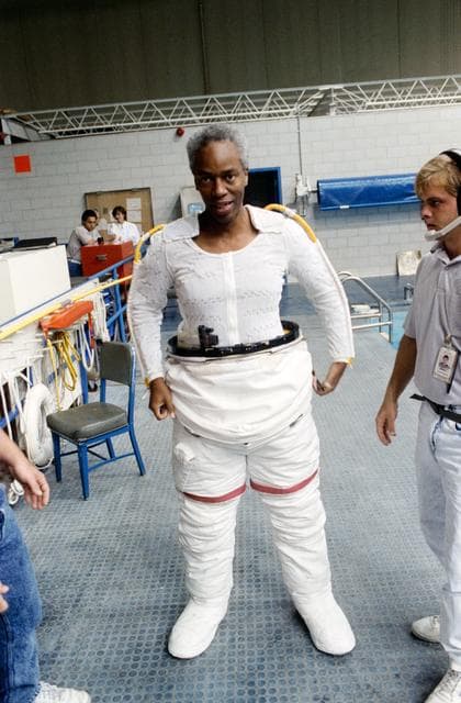 NASA image: STS-39 MS Bluford dons EMU lower torso in preparation for dive in JSC's WETF