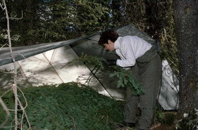 NASA image: ASCAN Helms sets up tent during survival training at Fairchild AFB