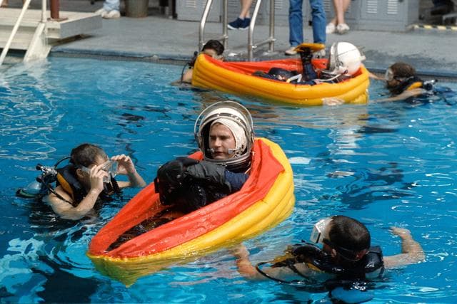 NASA image: STS-39 MS Hieb floats in single person life raft in JSC's WETF Bldg 29 pool