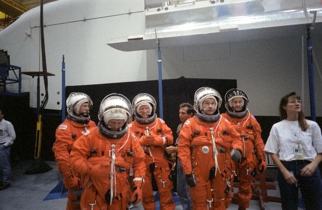 NASA image: STS-48 crewmembers, in LESs, prepare to for emergency egress training at JSC
