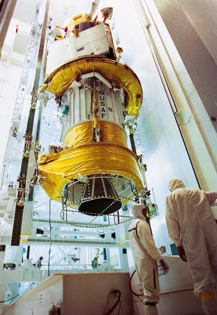 NASA image: STS-44 DSP satellite and IUS during preflight processing at Cape Canaveral