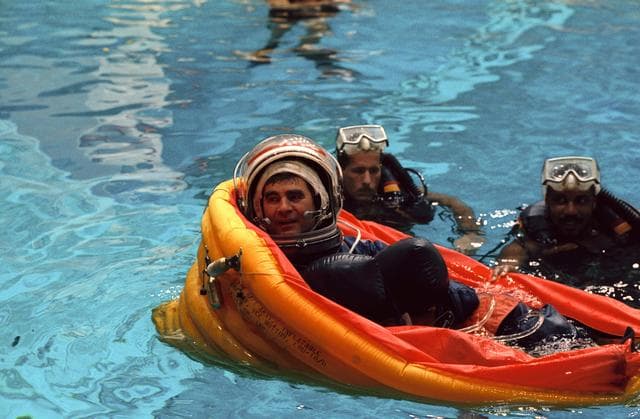 NASA image: STS-52 Mission Specialist Veach in life raft during JSC bailout exercises