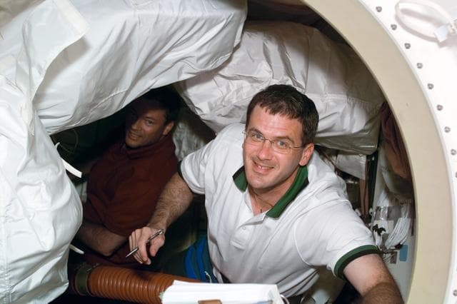 NASA image: STS-92 crewmember Peter (Jeff) Wisoff with Michael Lopez-Alegria in the background