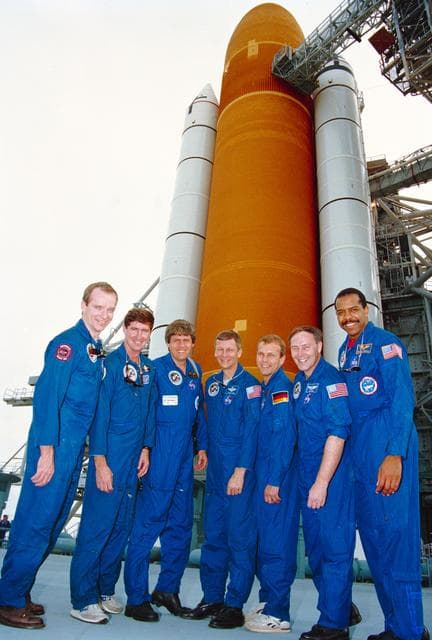 NASA image: STS-55 SL-D2 crew poses in front of ET/SRB at KSC Launch Complex (LC) Pad 39A