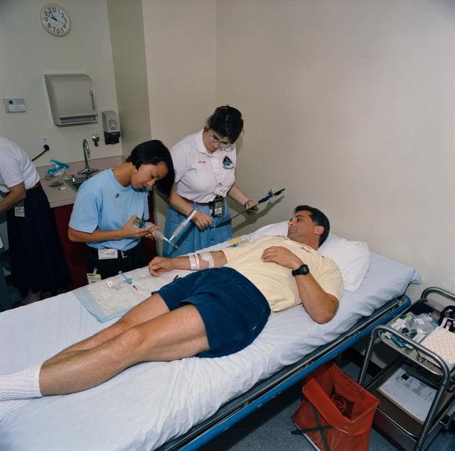 NASA image: STS-58 crewmembers participate in baseline data collection