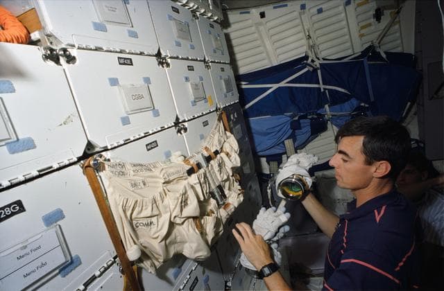 NASA image: Astronauts Allen, Gemar and Thout during EVA preparation training in CCT