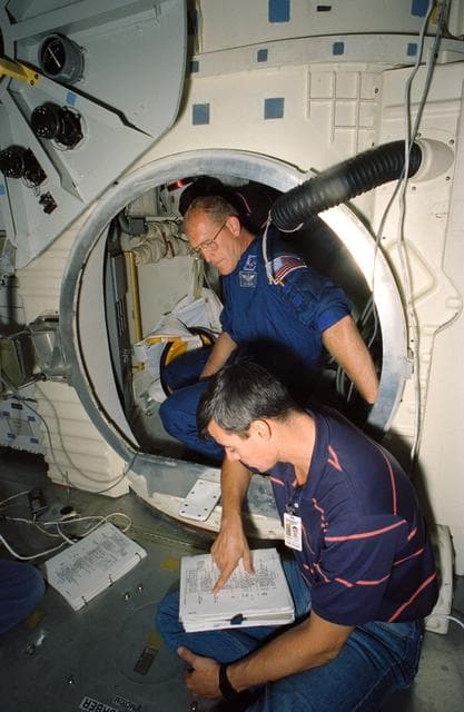 Astronauts Allen and Gemar during Extravehicular activity training in CCT
