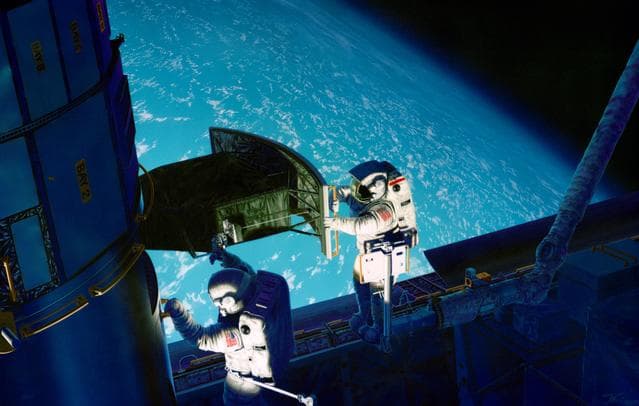NASA image: STS-61 art concept of astronauts during HST servicing