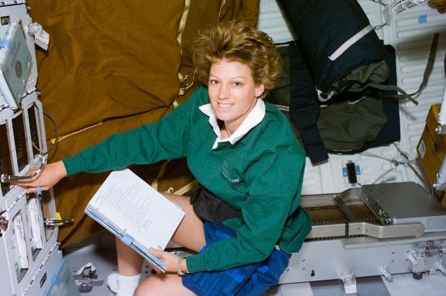NASA image: CCM-C,Collins checks the middeck experiment