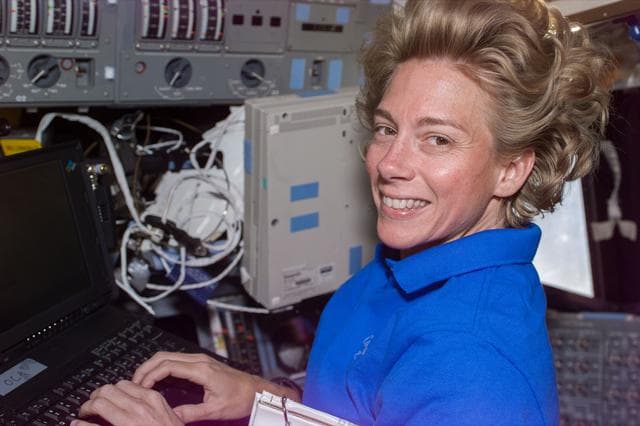 NASA image: Pilot Still on flight deck with laptop computer