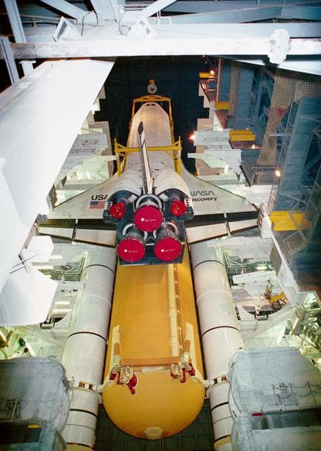 NASA image: Lifting the Orbiter Discovery into vertical position in the VAB