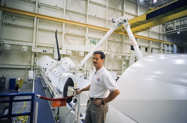 NASA image: Astronauts Hadfield and McArthur and visiting cosmonauts at bldg 9N MDF