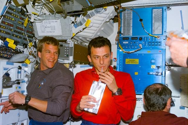 NASA image: Various views of the STS-95 crew on the Discovery's middeck