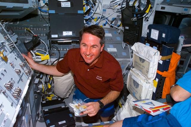 NASA image: Robinson at RMS controls on aft flight deck