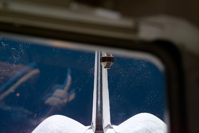 NASA image: PANSAT satellite deployment from STS-95 Discovery's payload bay
