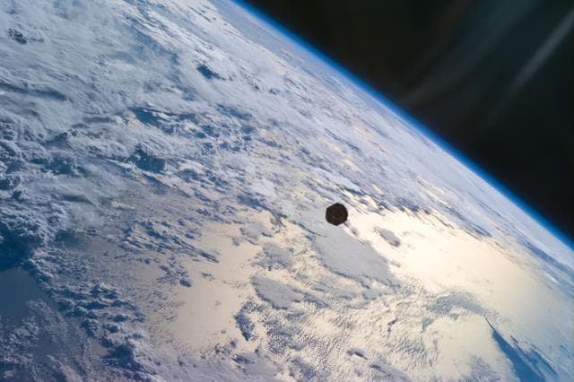 NASA image: PANSAT satellite deployment from STS-95 Discovery's payload bay