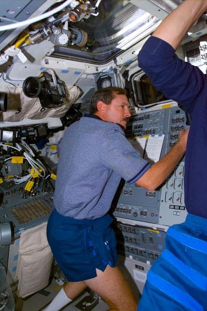 NASA image: Brown at aft flight deck control during SPARTAN capture