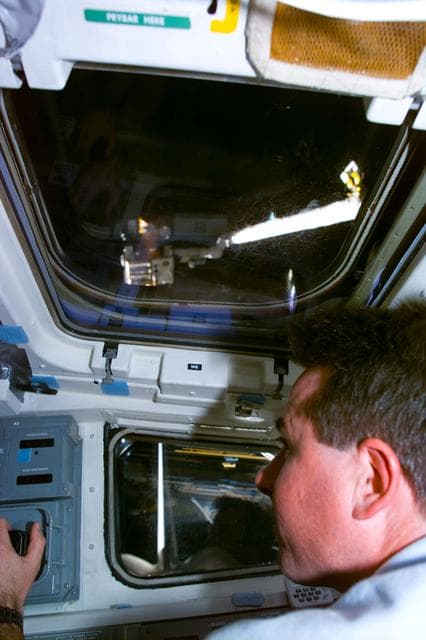 NASA image: Robinson at RMS control on flight deck during SPARTAN capture