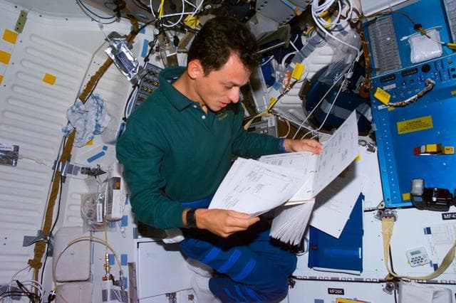 NASA image: Duque reviews checklist on middeck
