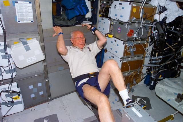NASA image: Glenn exercises on ergometer while on middeck